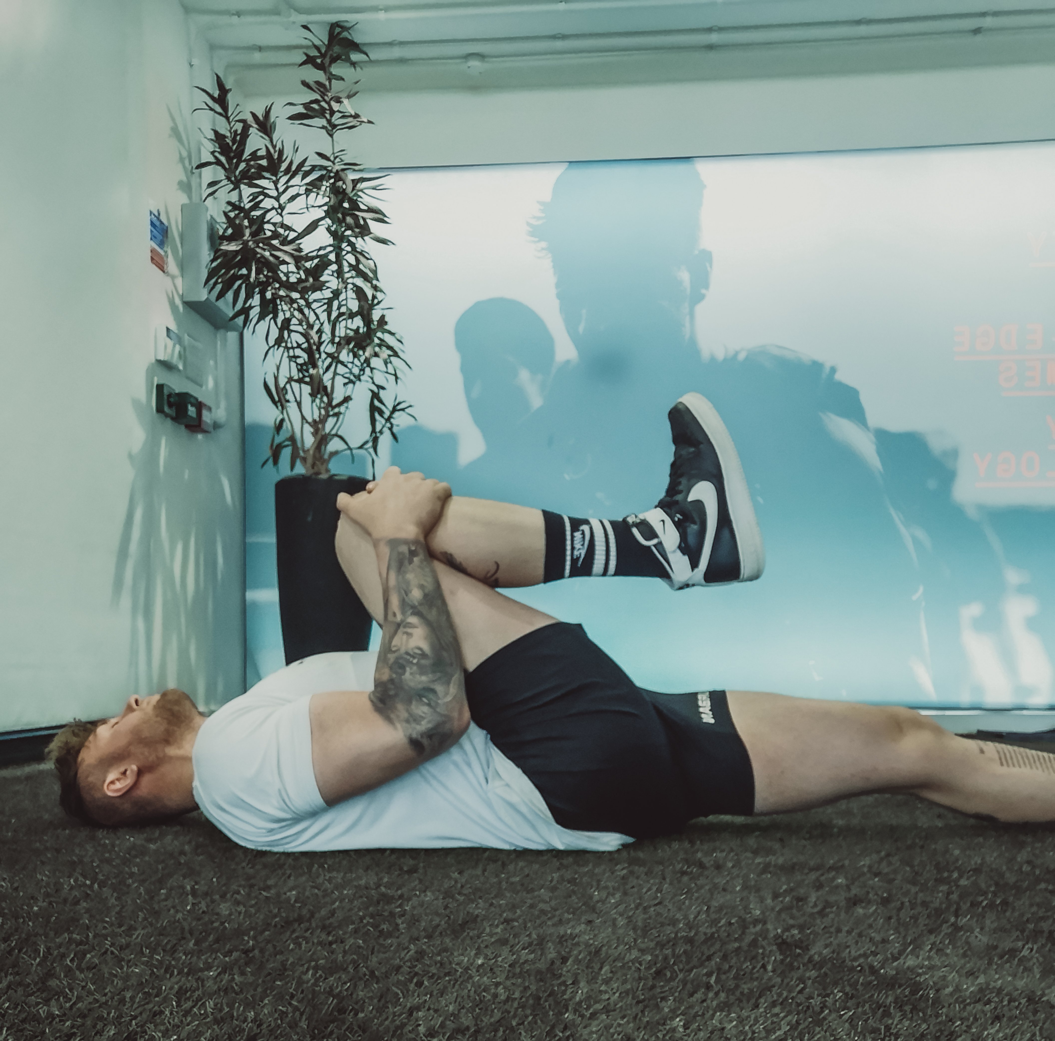 lying chest to knee stretch